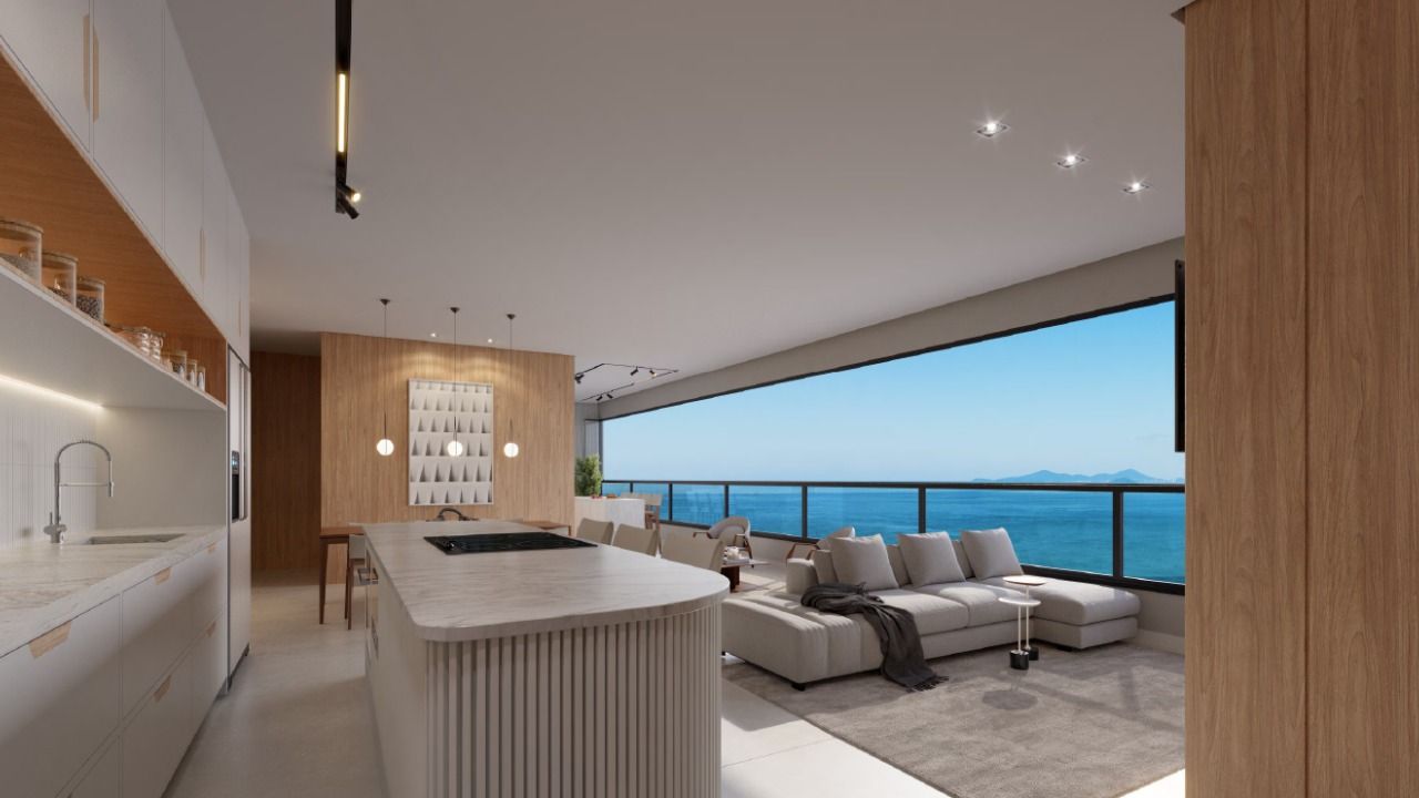 Cozinha integrada ao living em apartamento do Infinity Sea and Sky