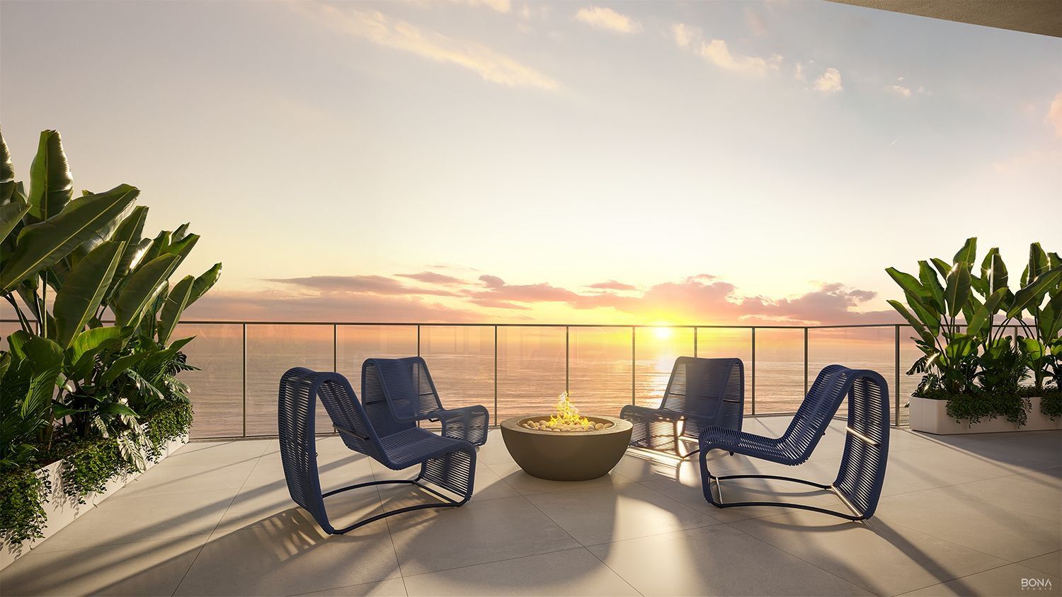 Fire place com poltronas e vista para o mar ao entardecer