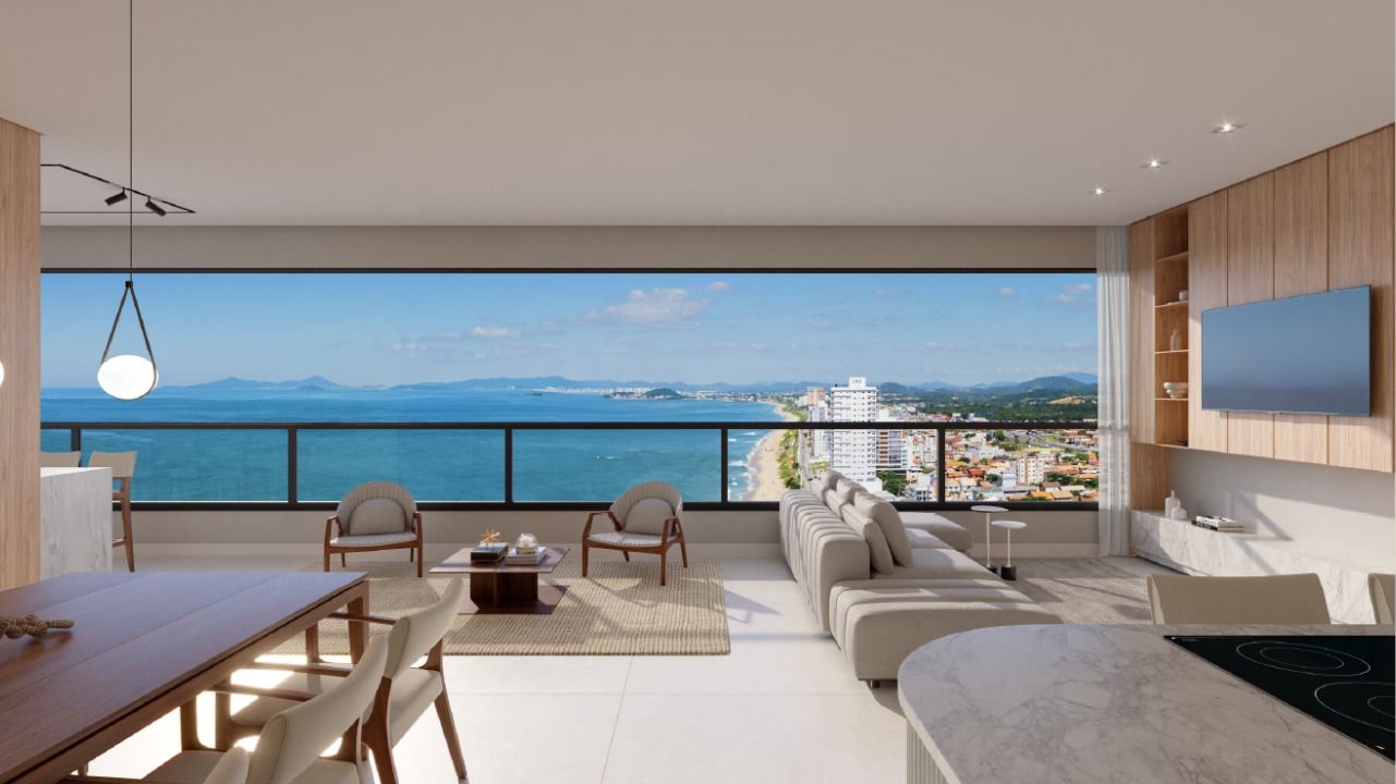 Living de apartamento do Infinity Sea and Sky, com vista para o mar