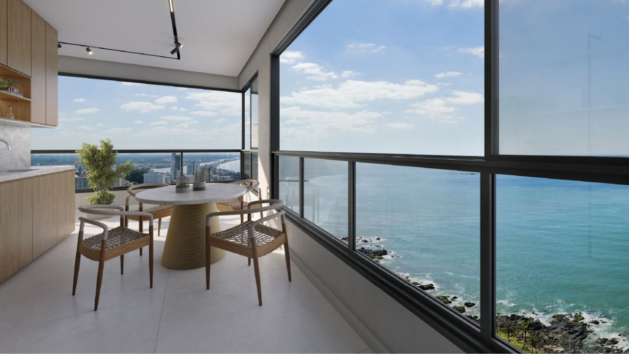 Sacada de apartamento do Infinity Sea and Sky, com mesa e vista para o mar